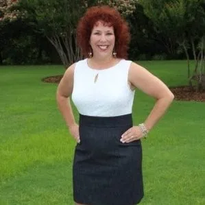 Kathy A. Jenkins, CPA, standing outdoors in a sleeveless white top and dark skirt